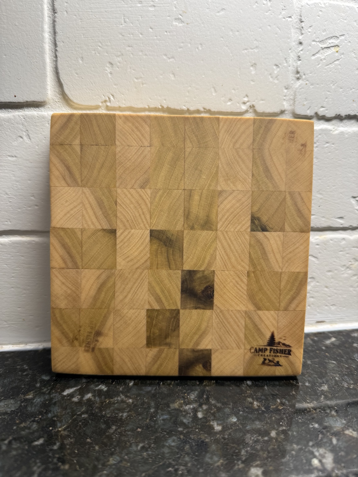 Handcrafted end-grain cutting board with Camp Fisher Creations brand
