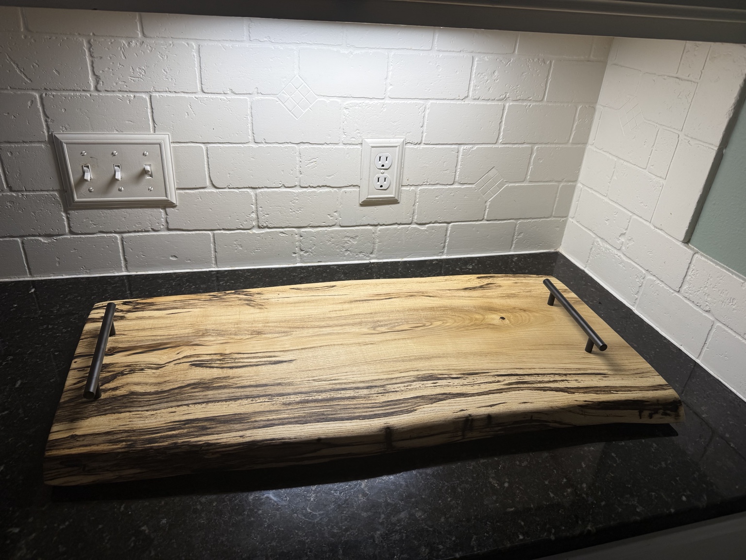 Large live-edge serving tray with black handles